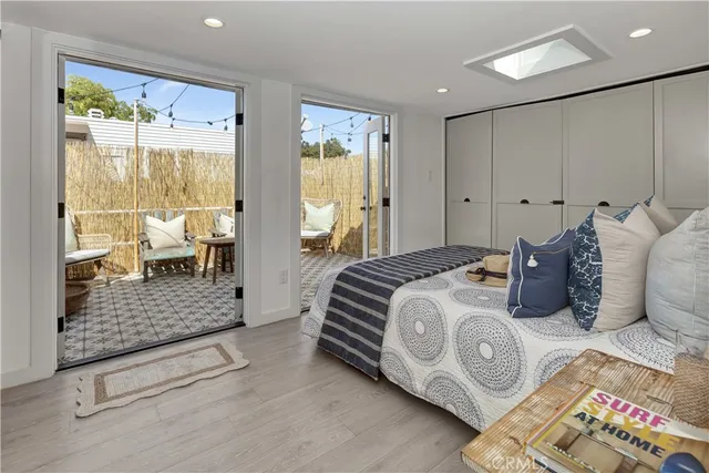 a bedroom with bed and glass door