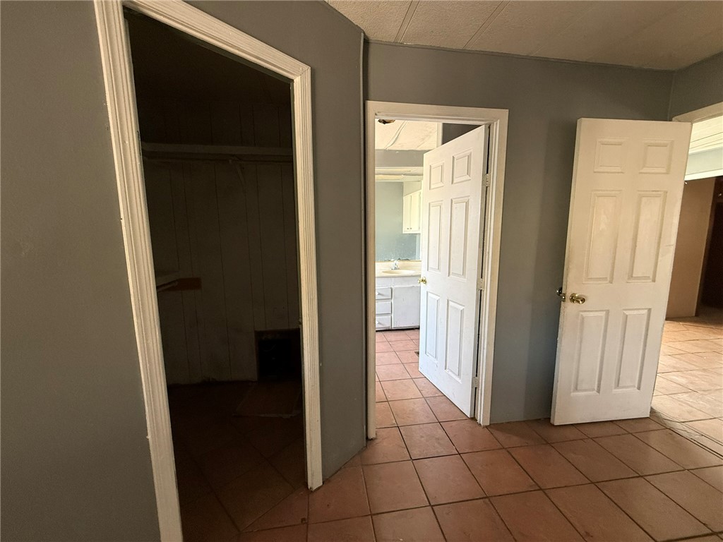 1629 Ramar Road Bullhead City, AZ 86442 - Photo 13 of 29 Corridor featuring tile patterned floors