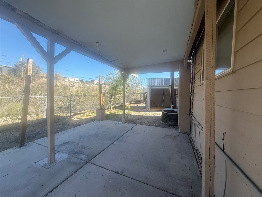 1629 Ramar Road Bullhead City, AZ 86442 - Photo 6 of 29 Fenced backyard featuring a patio and a gate