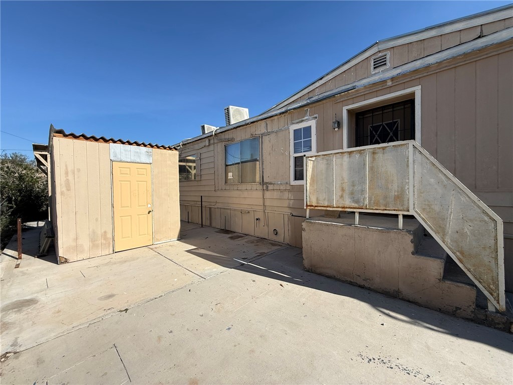 1629 Ramar Road Bullhead City, AZ 86442 - Photo 9 of 29 View of patio / terrace featuring a storage unit