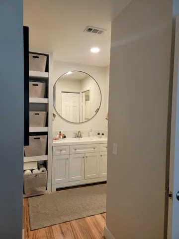 a view of kitchen with cabinets