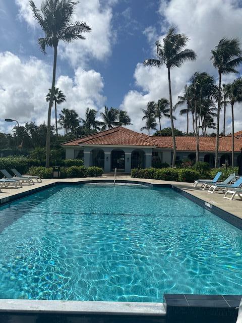 3209 Clint Moore Road, Unit 202 Boca Raton, FL 33496 - Photo 19 of 24 a view of a house with a swimming pool