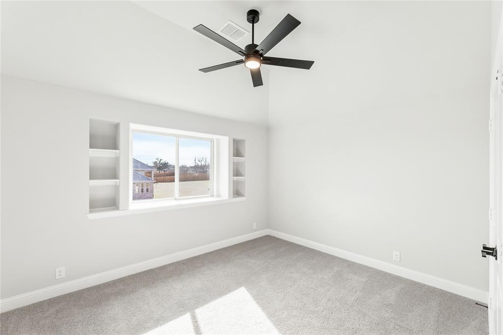 683 Crystal Lk Lane Red Oak, TX 75154 - Photo 34 of 39 an empty room with a window and a fan