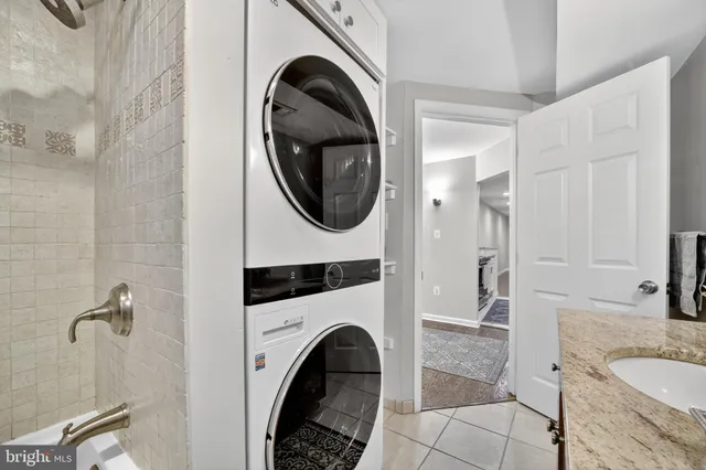 a bathroom with a sink a toilet and a shower