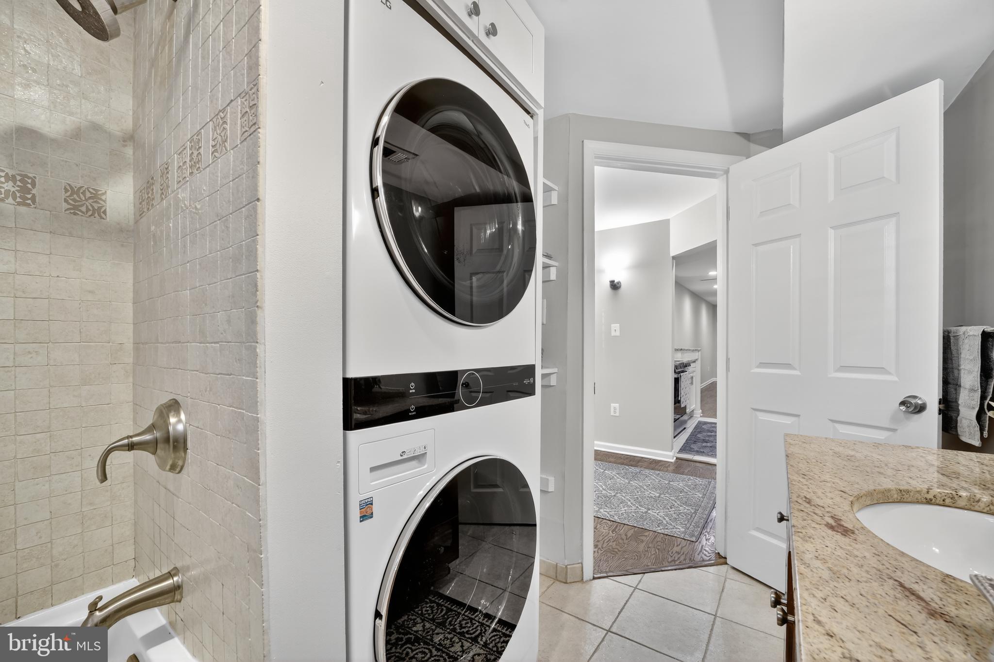 1421 T Street Northwest, Unit 2 Washington, DC 20009 - Photo 18 of 24 a bathroom with a sink a toilet and a shower