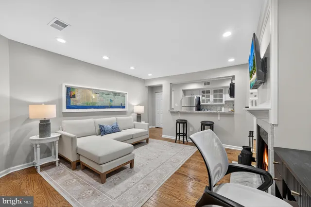 a living room with furniture and a lamp
