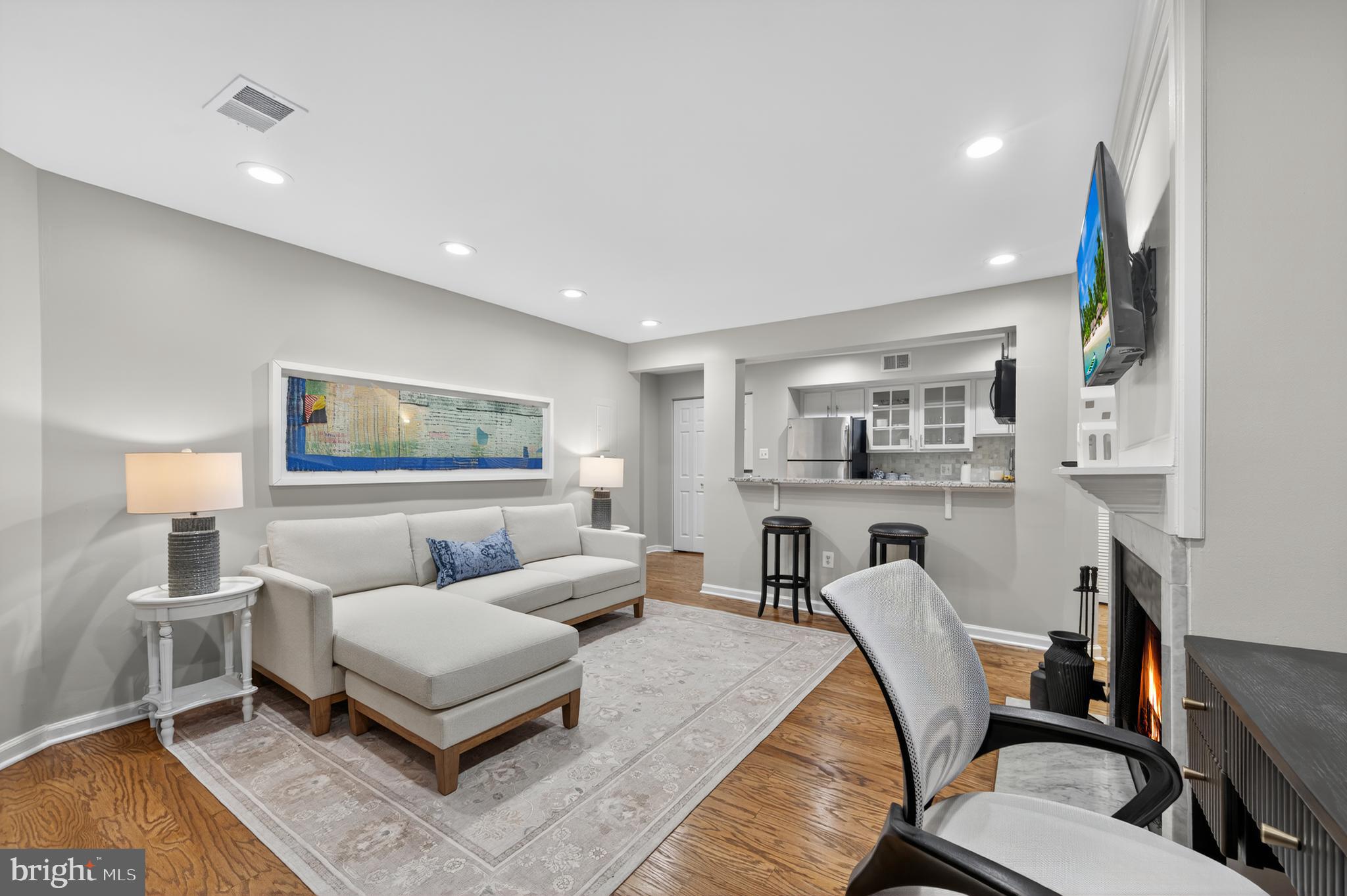 1421 T Street Northwest, Unit 2 Washington, DC 20009 - Photo 6 of 24 a living room with furniture and a lamp