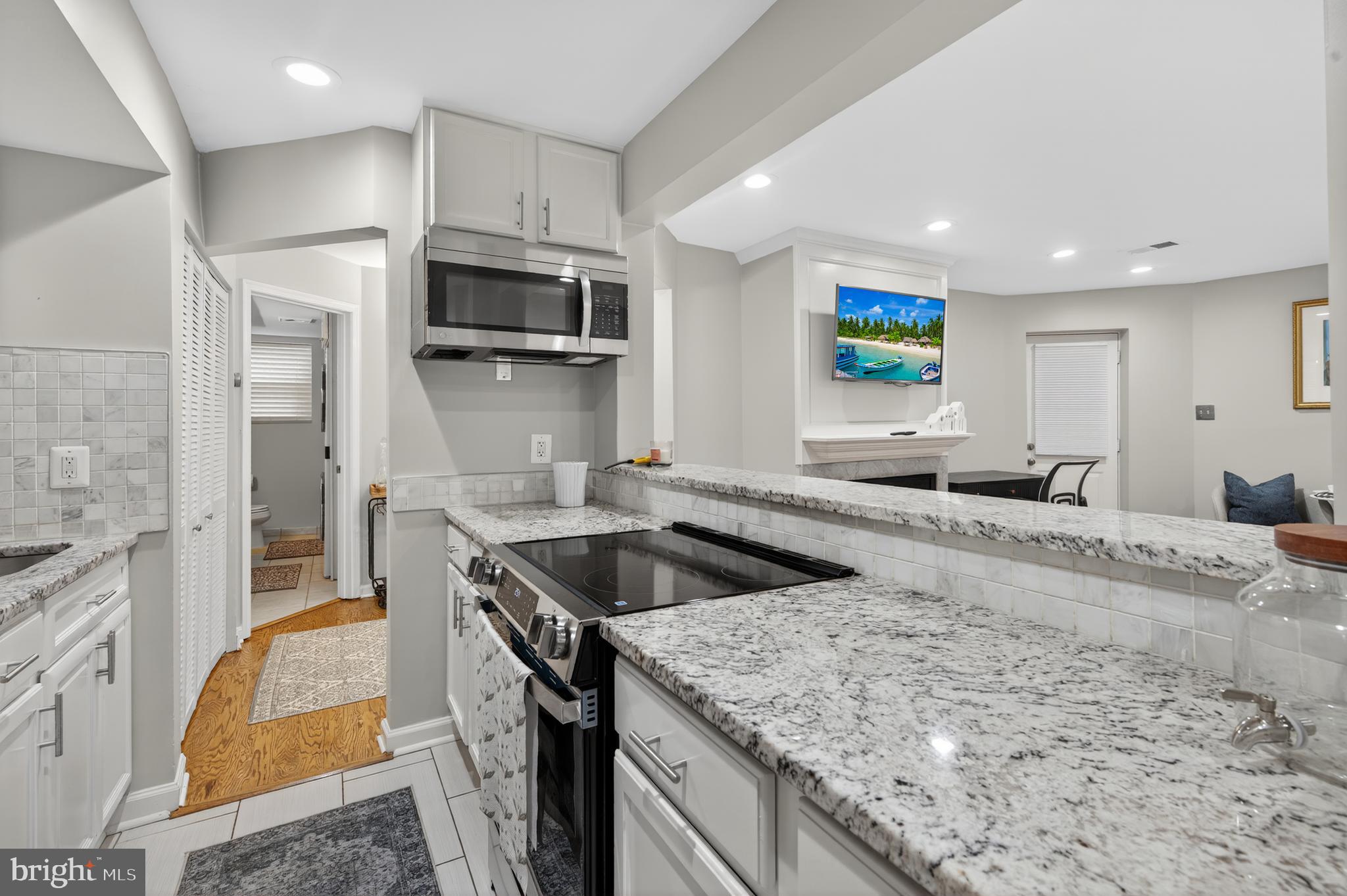 1421 T Street Northwest, Unit 2 Washington, DC 20009 - Photo 9 of 24 a kitchen with stainless steel appliances granite countertop a sink and a stove