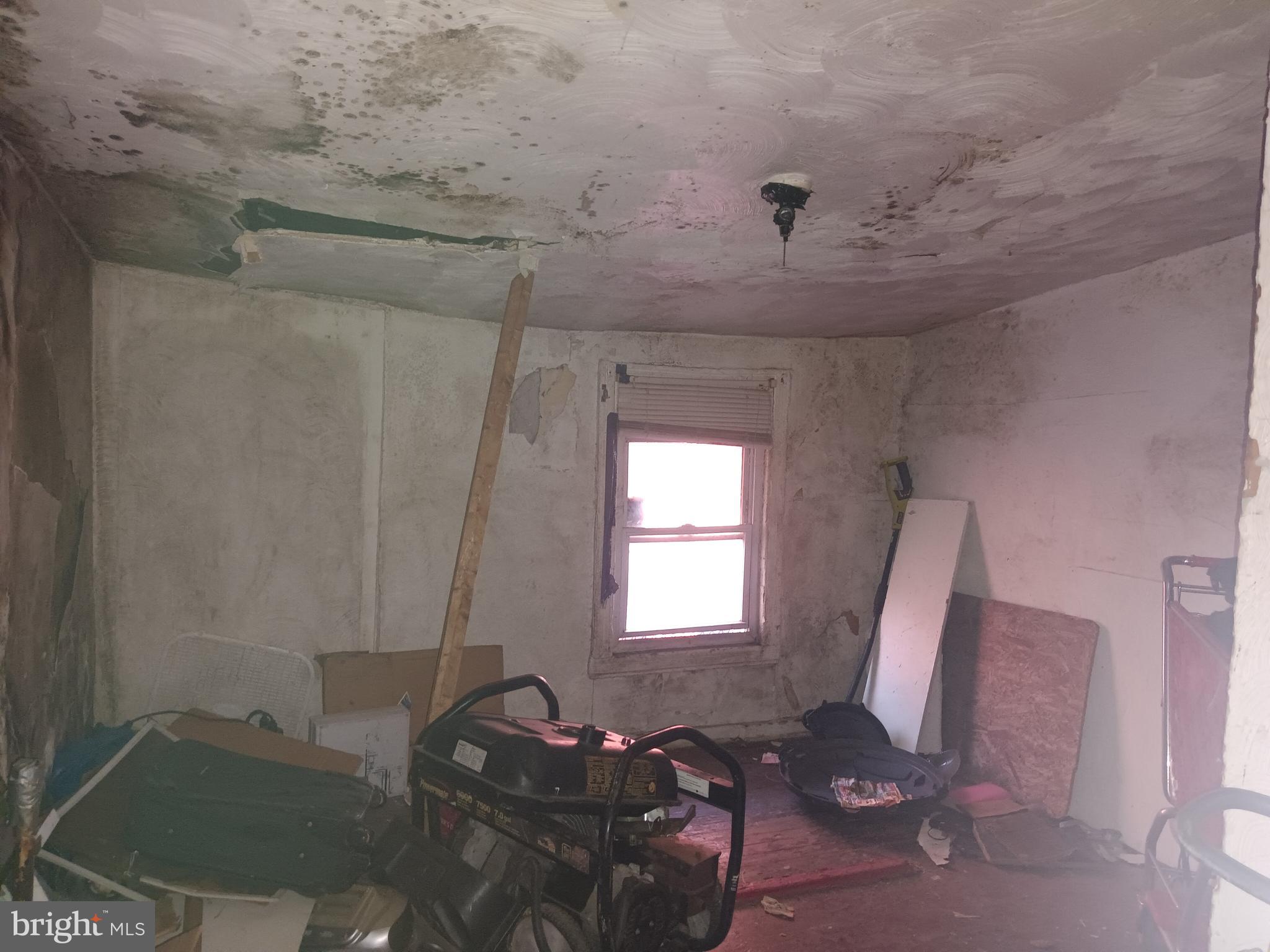 1302 North Spring Street Baltimore, MD 21213 - Photo 3 of 11 a living room with furniture