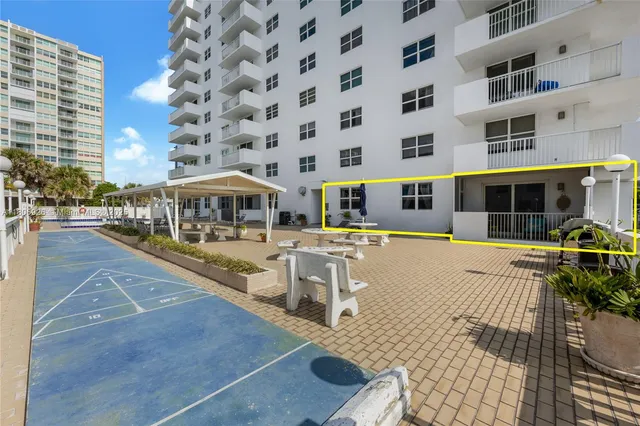 a view of a building with sitting area