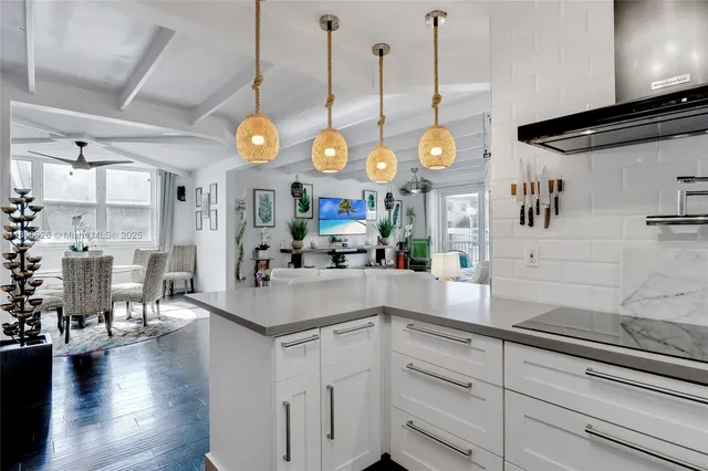 a kitchen with stove and cabinets