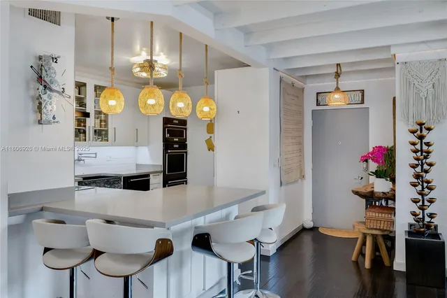 a view of kitchen and dining area with furniture