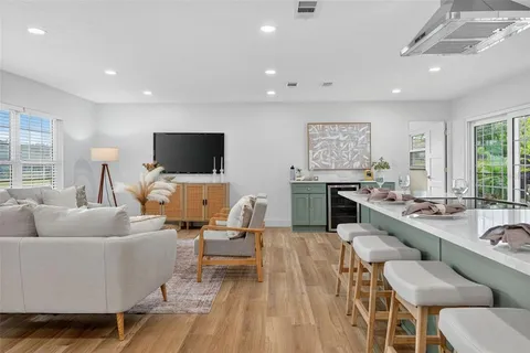 a living room with furniture flowerpot and window