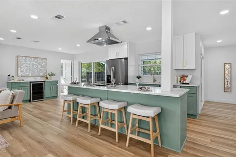 a kitchen with a stove and a sink