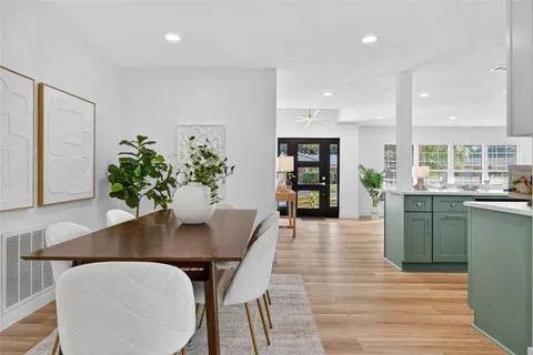 a view of a room that has a bed and a window in it