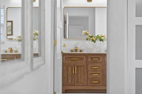 a patio with yard glass top table and chairs