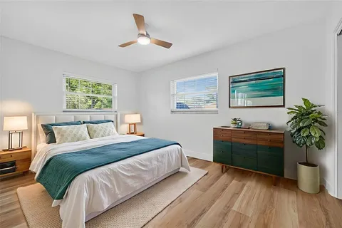 an aerial view of residential houses with city view