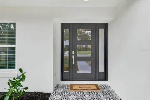 a close view of dining table with chairs