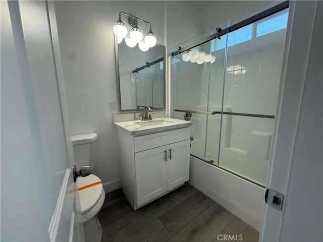 a bathroom with a sink mirror and vanity
