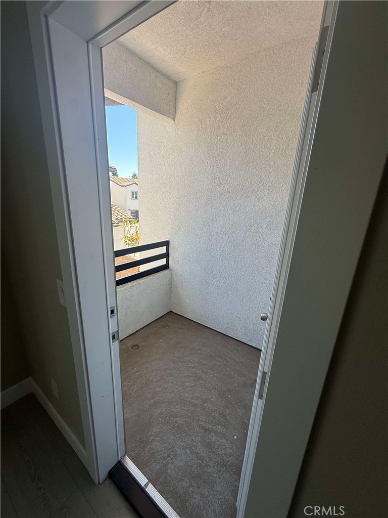 15909 Merrill Avenue, Unit 9 Fontana, CA 92335 - Photo 18 of 19 an empty room with windows