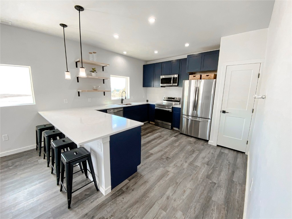 344 Redhill Road Fairplay, CO 80440 - Photo 11 of 34 a kitchen with stainless steel appliances a refrigerator a sink a stove a dining table and chairs