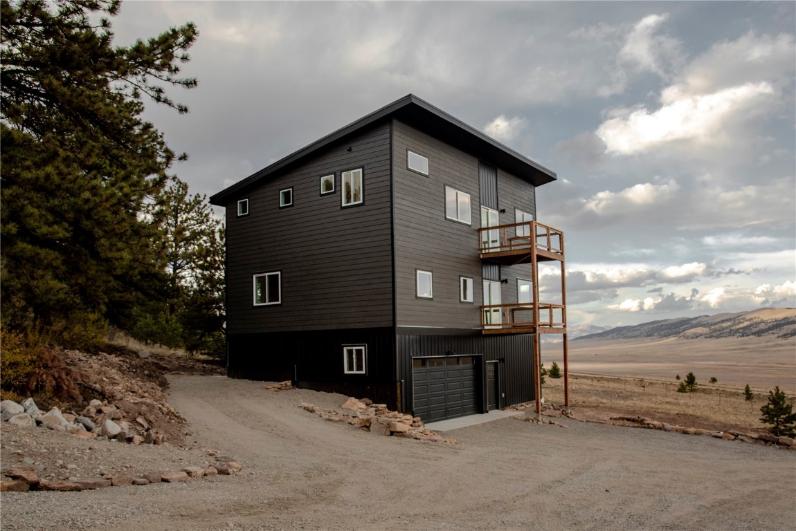 344 Redhill Road Fairplay, CO 80440 - Photo 3 of 34 a front view of a house with yard