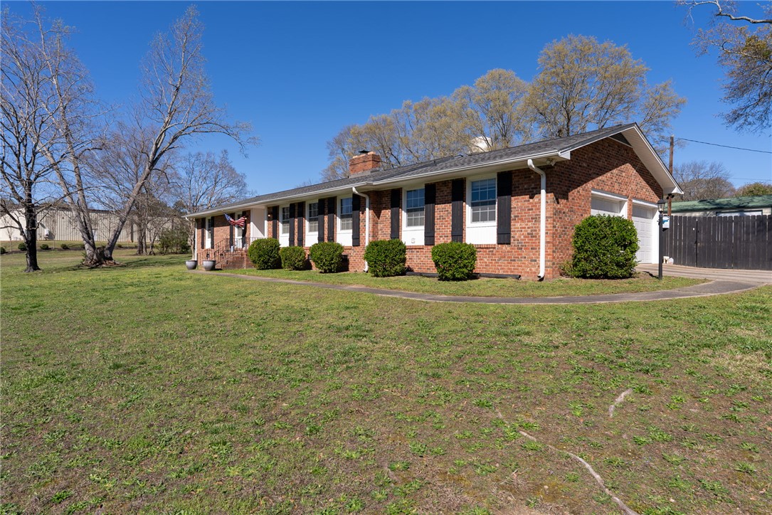 300 Green Street Williamston, SC 29697 - Photo 43 of 47 This classic brick residence features an attached garage and a welcoming front entrance.