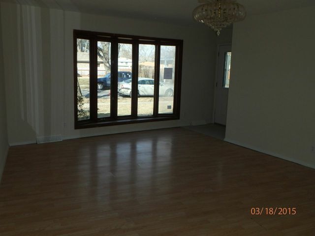 15231 Millard Avenue Midlothian, IL 60445 - Photo 2 of 15 a view of wooden floor and windows in a room