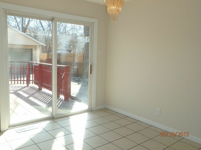 15231 Millard Avenue Midlothian, IL 60445 - Photo 12 of 15 a view of empty room with wooden floor and fan