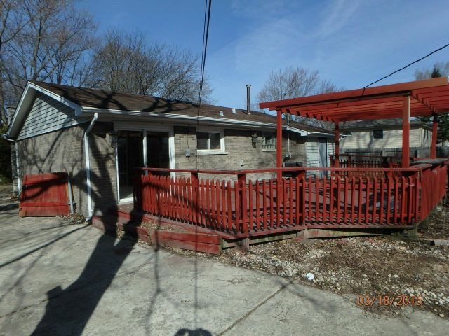 15231 Millard Avenue Midlothian, IL 60445 - Photo 15 of 15 a view of a house with a wooden fence