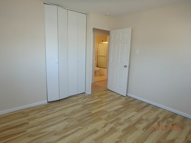 15231 Millard Avenue Midlothian, IL 60445 - Photo 6 of 15 a view of an empty room with wooden floor