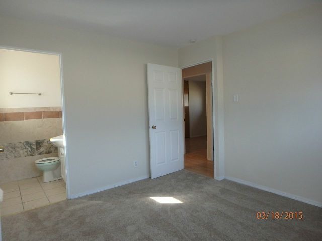 15231 Millard Avenue Midlothian, IL 60445 - Photo 7 of 15 a view of an empty room and a bathroom