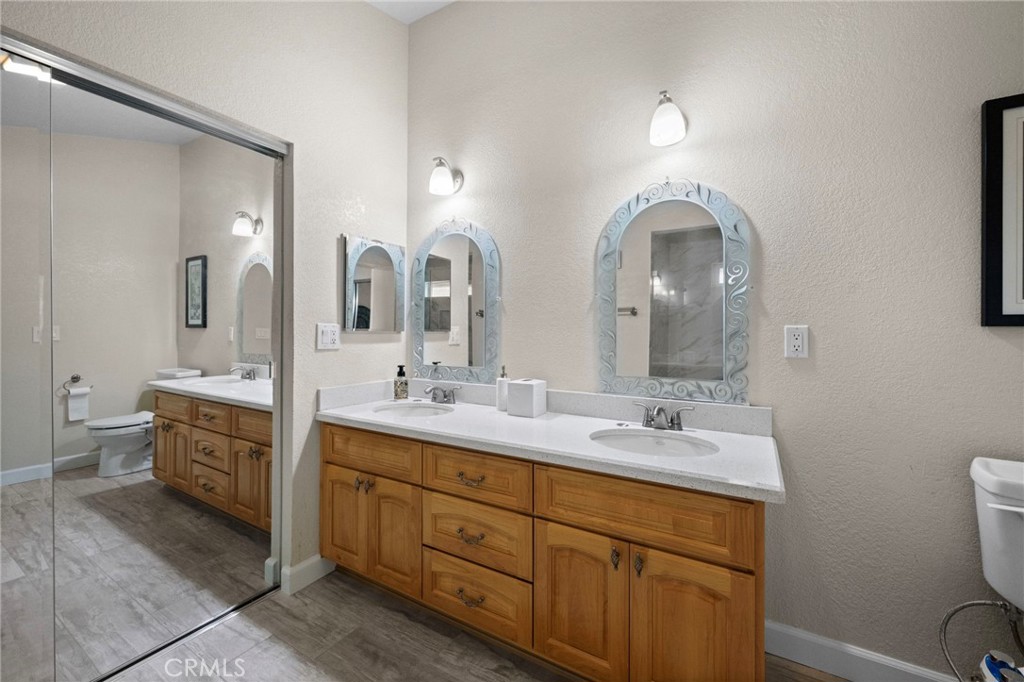 605 Bronco Way Walnut, CA 91789 - Photo 41 of 69 a spacious bathroom with a double vanity sink a mirror and a toilet