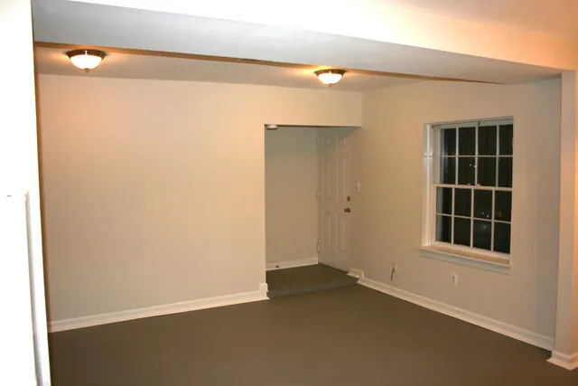a view of empty room with windows