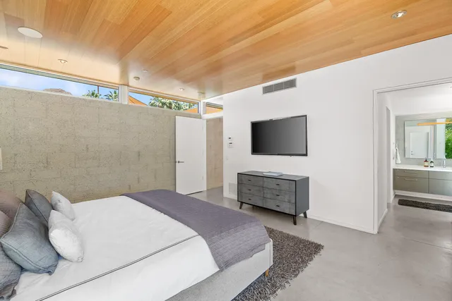 a bathroom with a glass shower door and a sink