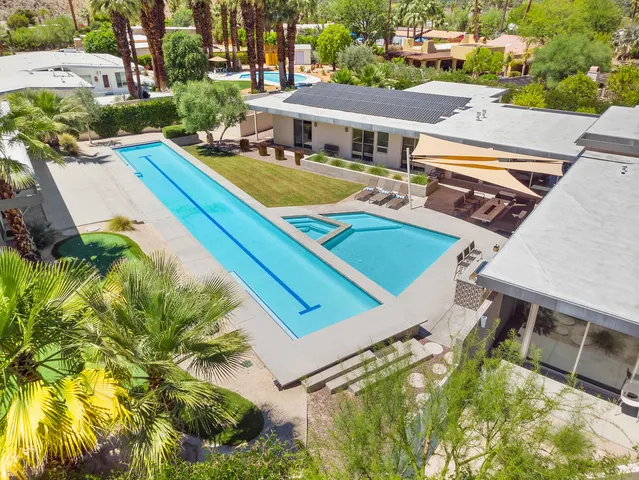 a kitchen with stainless steel appliances a sink and cabinets