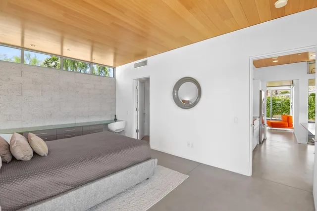 a house with swimming pool in front of it