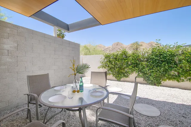a view of swimming pool with outdoor seating and yard