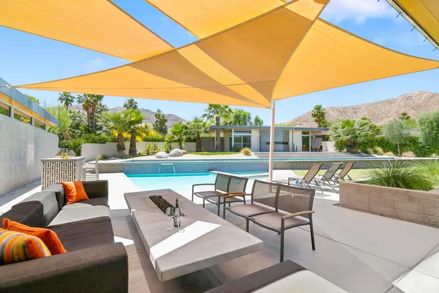 a bedroom with a bed and a view of bathroom