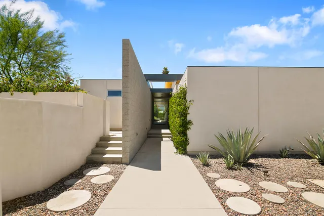 a kitchen with sink stove and cabinets