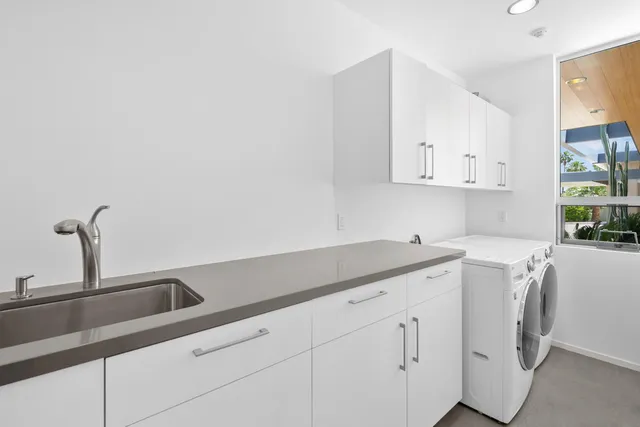 a view of a swimming pool with outdoor seating