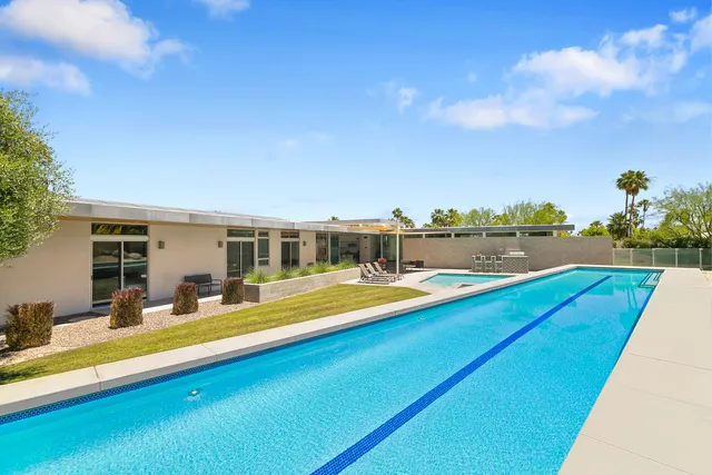 a view of living room with furniture and floor to ceiling window