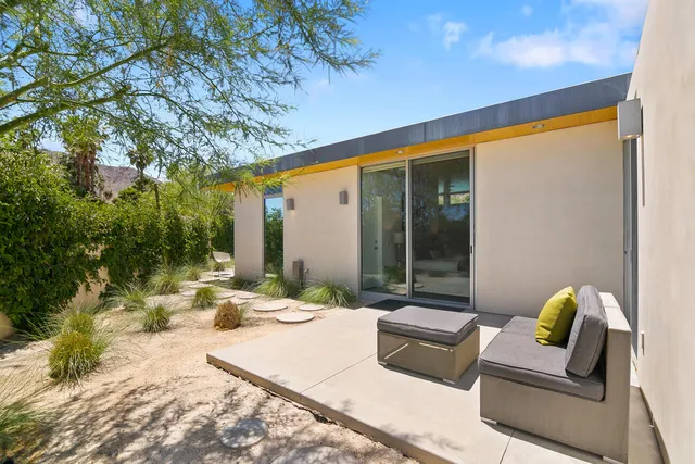 a view of a swimming pool with an outdoor seating