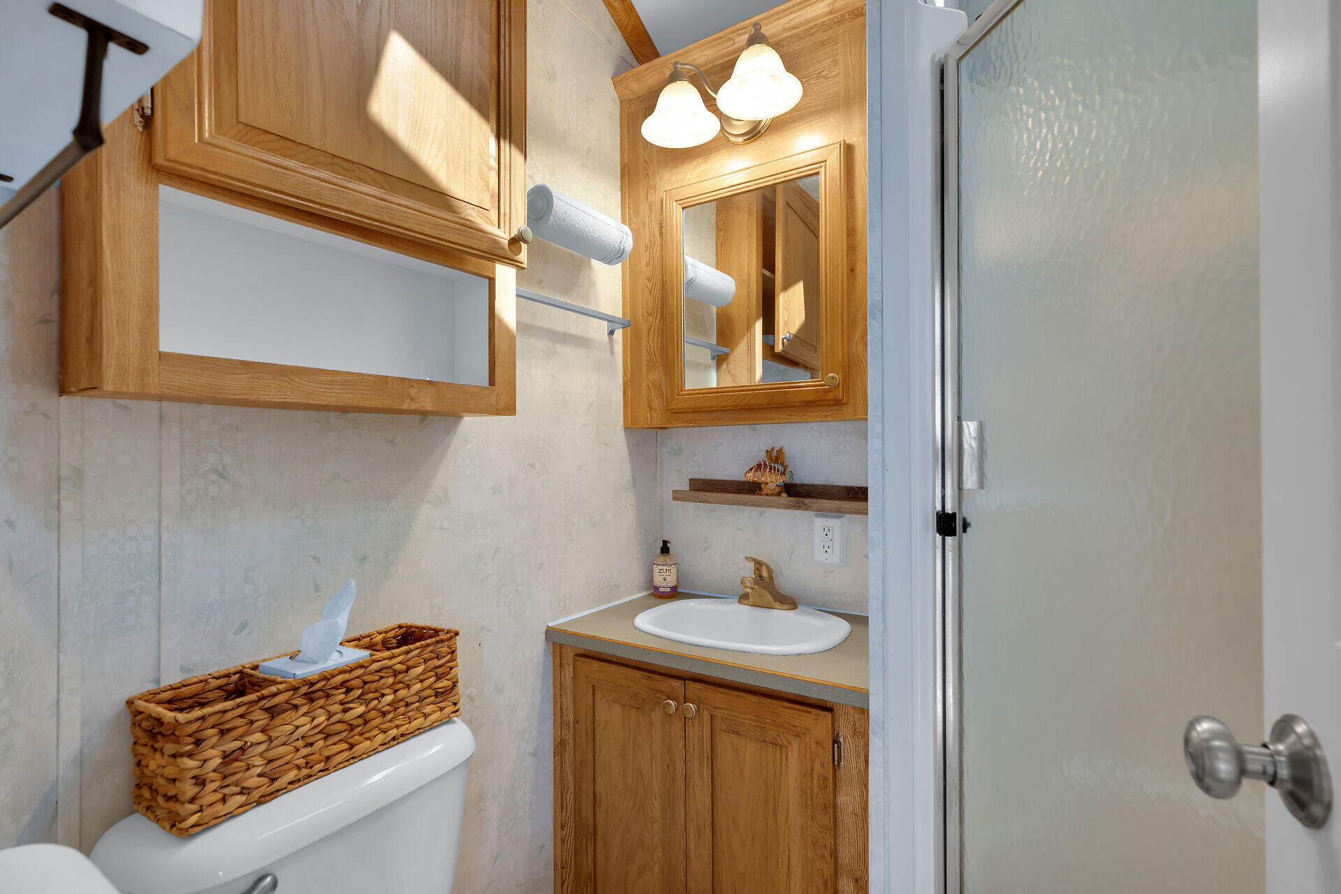 325 Calusa Street, Unit 213 Key Largo, FL 33037 - Photo 18 of 60 a bathroom with a sink and a mirror