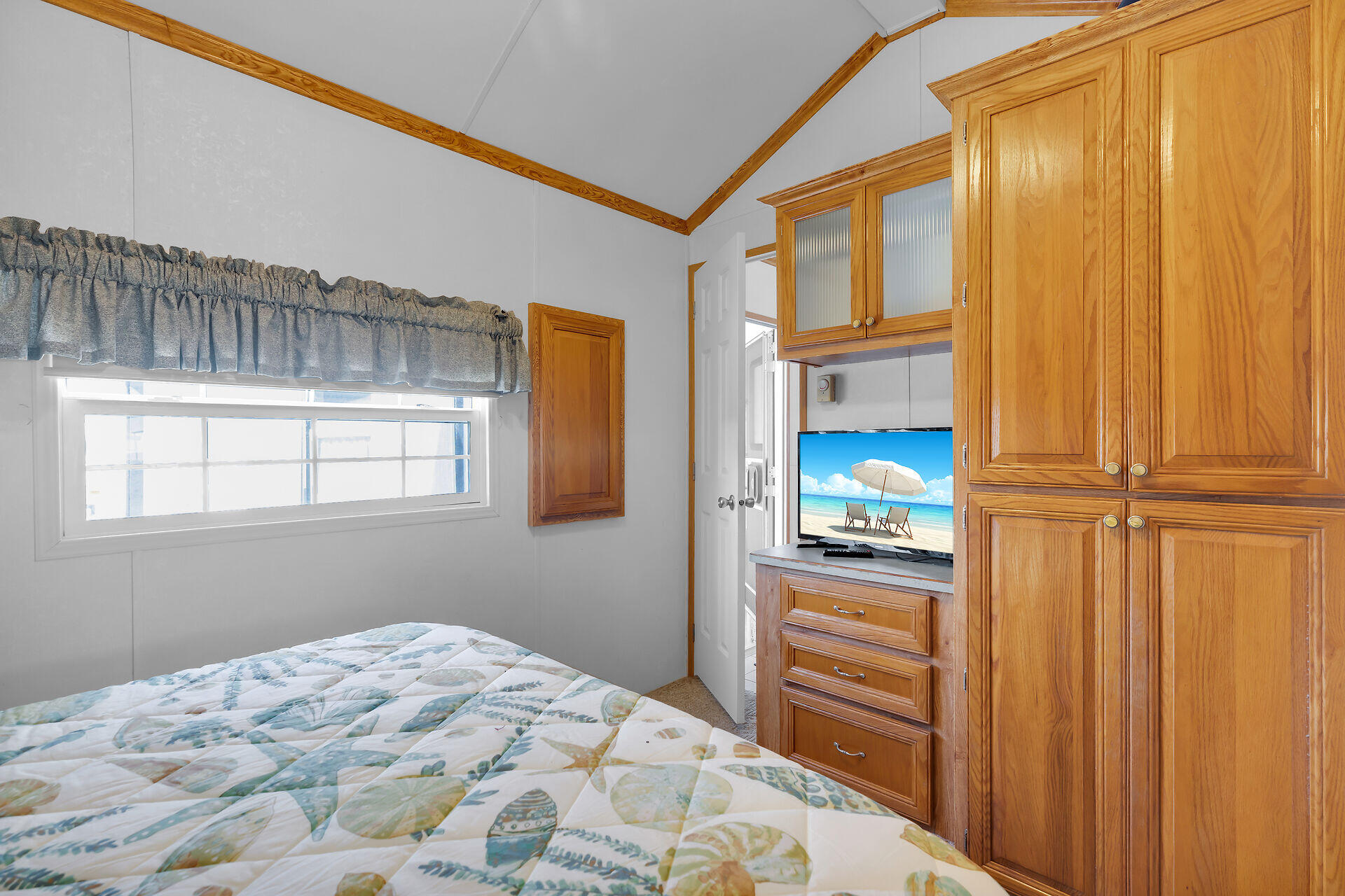 325 Calusa Street, Unit 213 Key Largo, FL 33037 - Photo 21 of 60 a bedroom with a bed and a window