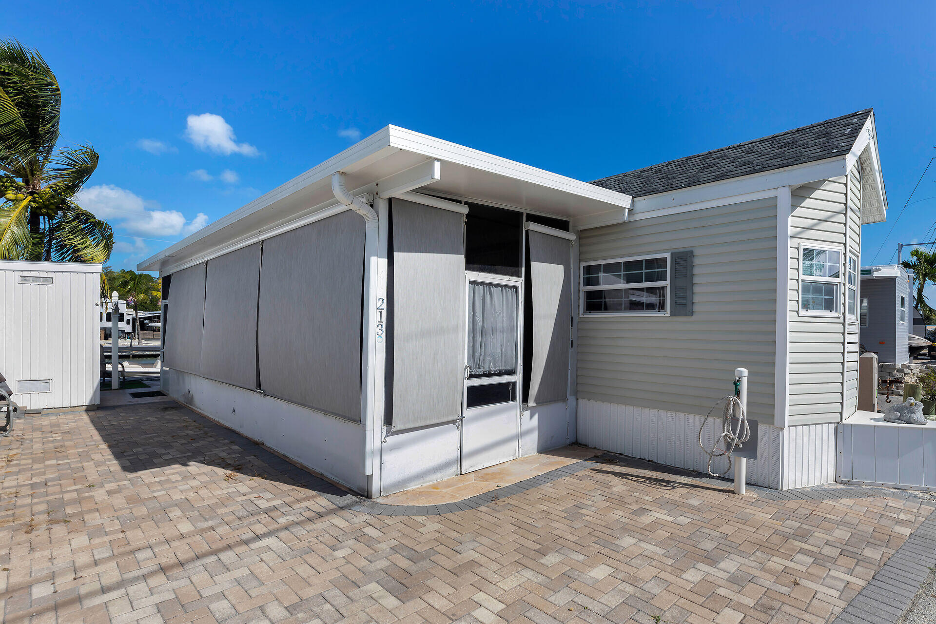 325 Calusa Street, Unit 213 Key Largo, FL 33037 - Photo 36 of 60 a view of backyard with cabin