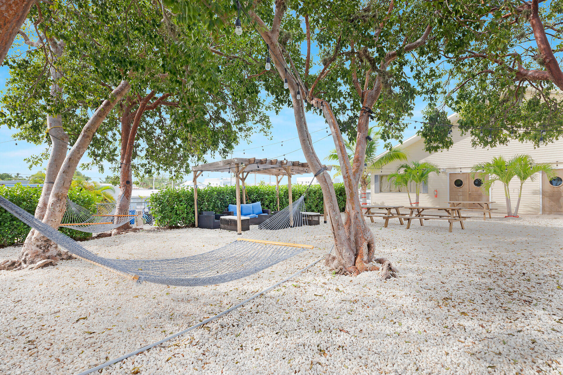 325 Calusa Street, Unit 213 Key Largo, FL 33037 - Photo 43 of 60 a view of a backyard with large trees