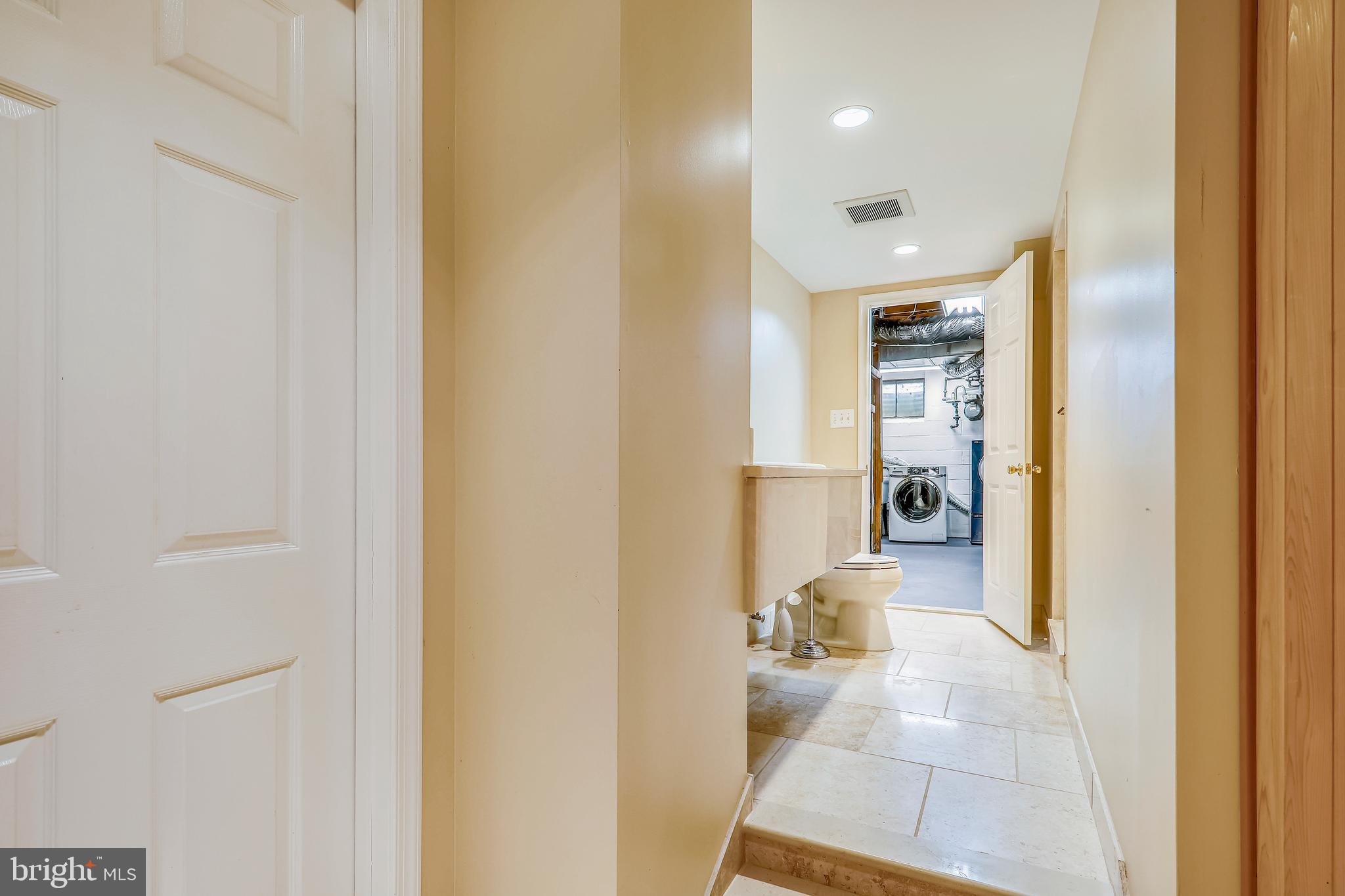 11817 Smoketree Road Potomac, MD 20854 - Photo 38 of 60 Access to basement laundry