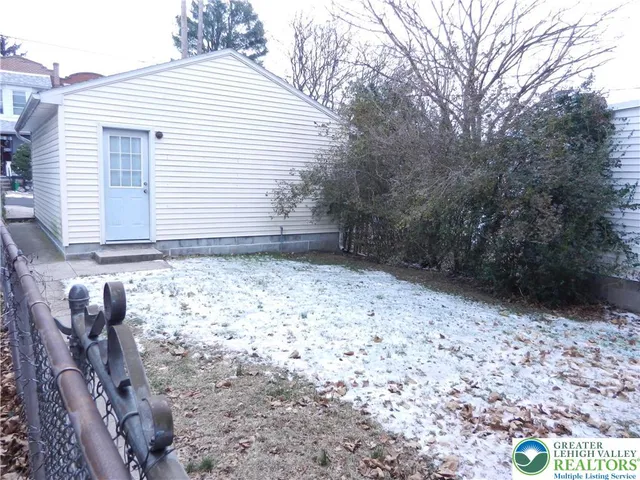 a view of a backyard of the house