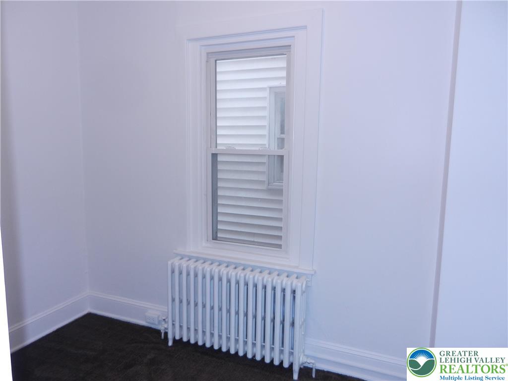 1428 Center Street, Unit 1 Bethlehem, PA 18018 - Photo 8 of 9 a view of a bedroom with wooden floor